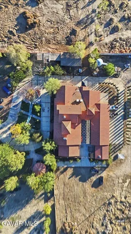 a view of a porch with a table and chairs