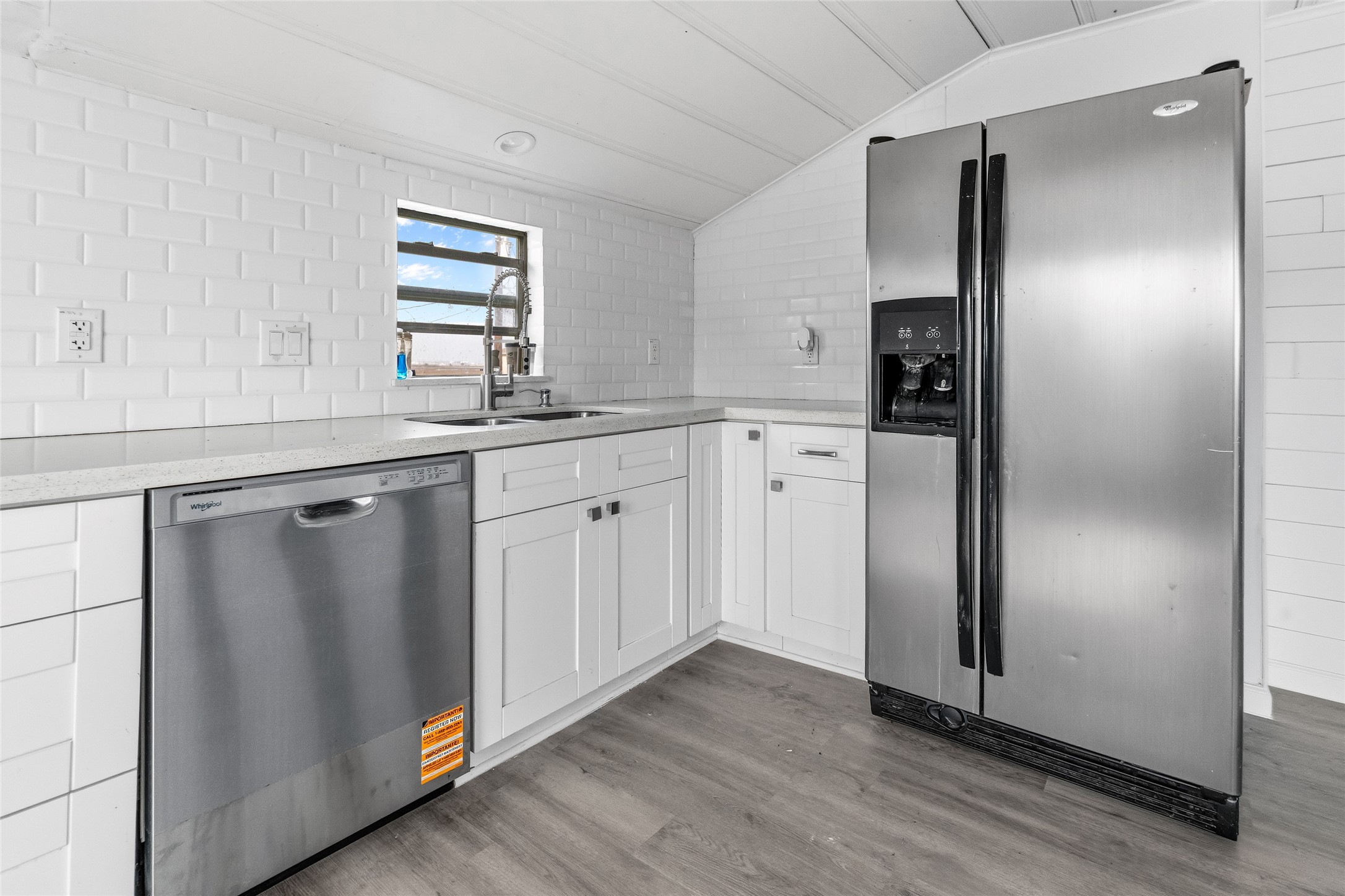 416 Seabean Street Surfside Beach, TX 77541 - Photo 14 of 27 a kitchen with stainless steel appliances granite countertop a refrigerator and a sink