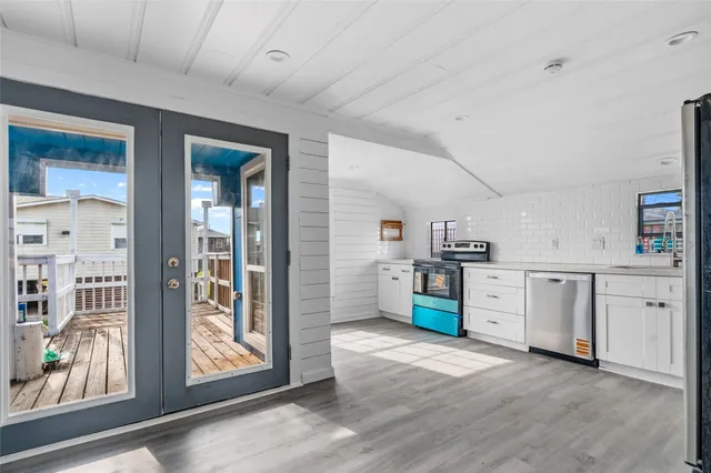 a view of a kitchen with electric appliances