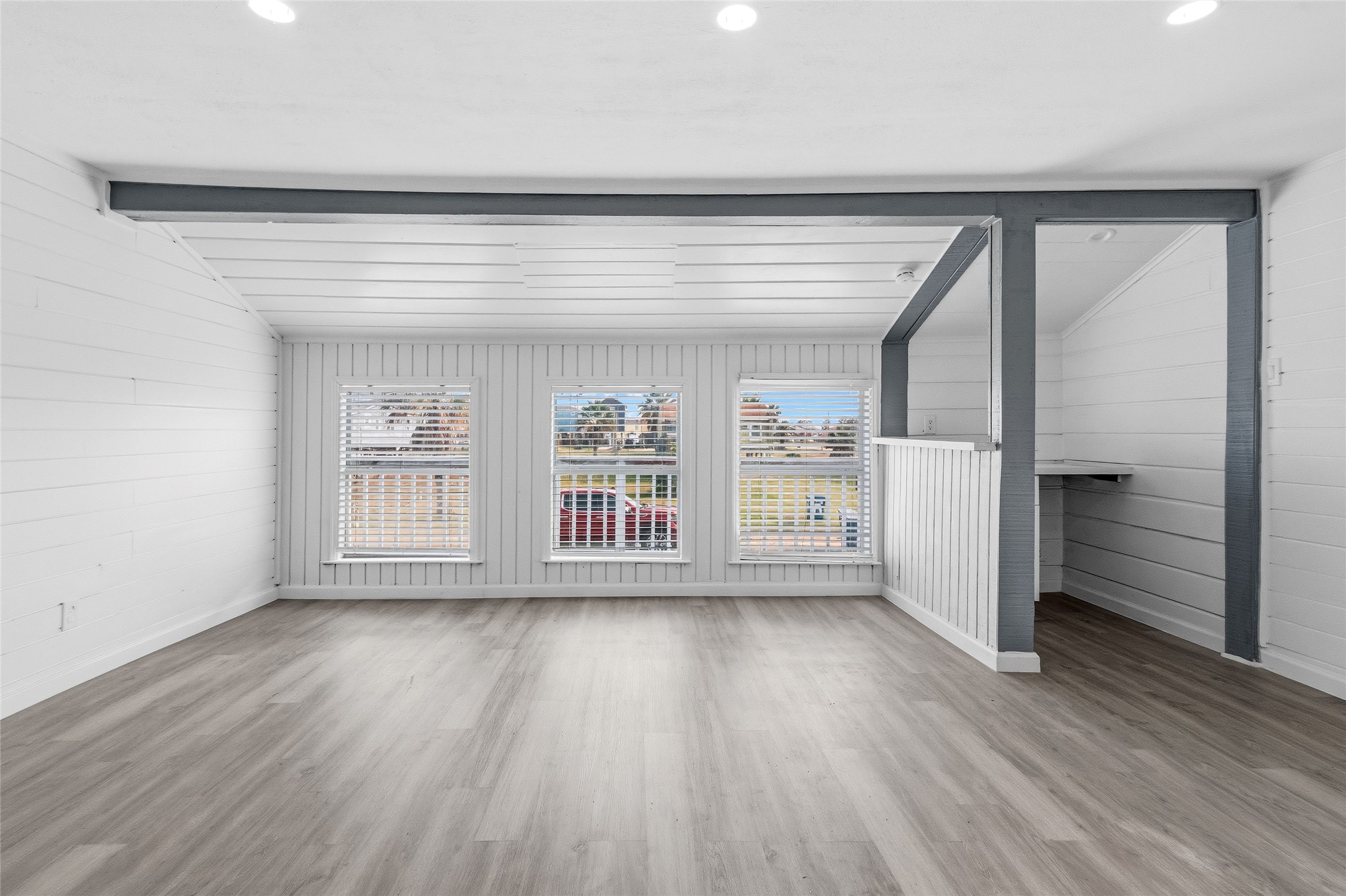 416 Seabean Street Surfside Beach, TX 77541 - Photo 16 of 27 wooden floor in an empty room with a window