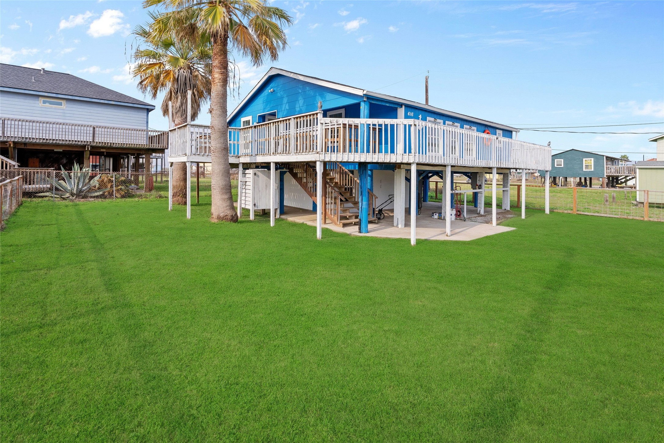 416 Seabean Street Surfside Beach, TX 77541 - Photo 2 of 27 a view of a house with a yard and sitting area