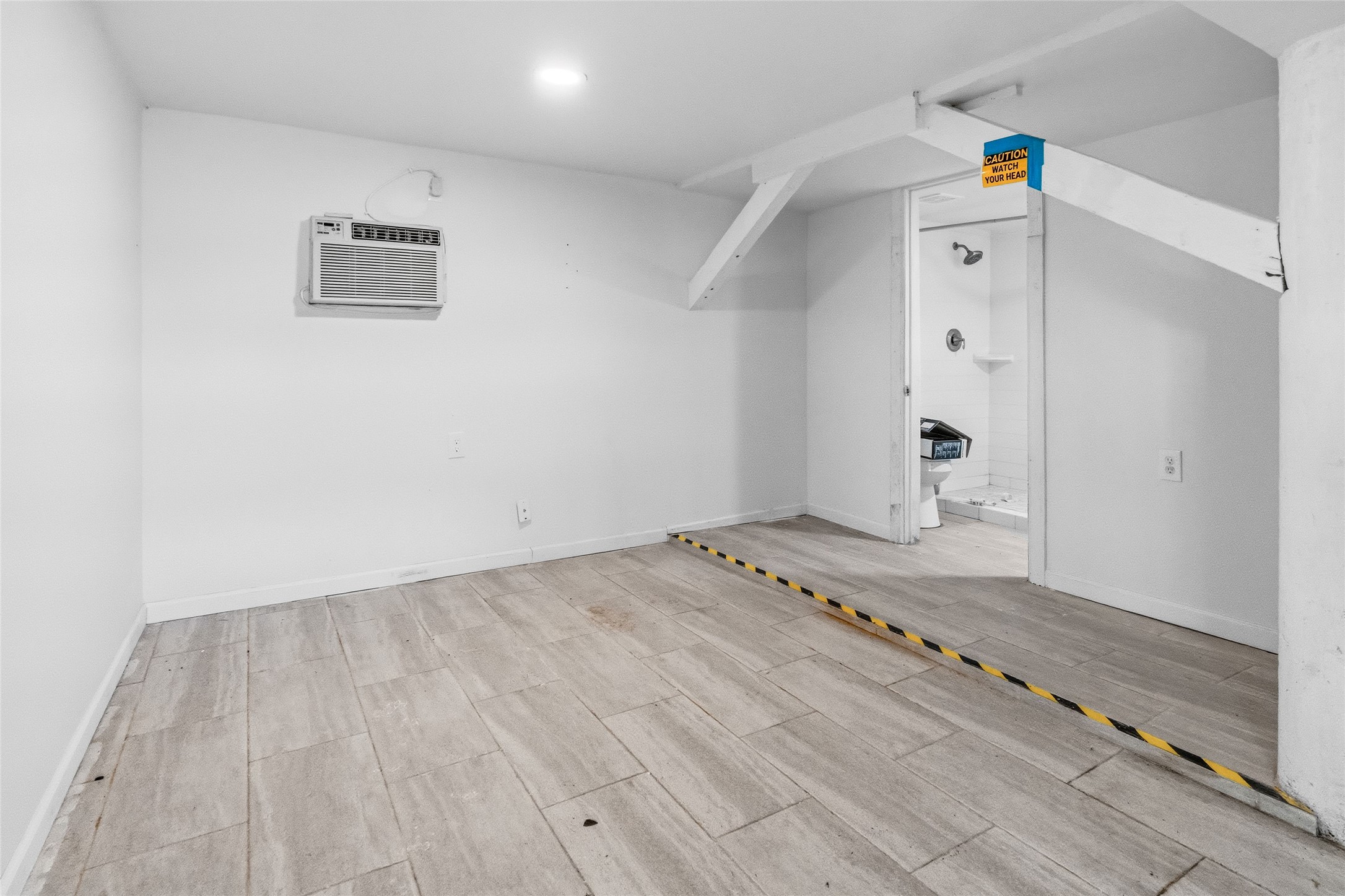 416 Seabean Street Surfside Beach, TX 77541 - Photo 10 of 27 a view of a room with wooden floor