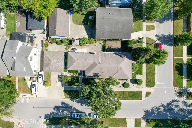 an aerial view of residential houses with outdoor space