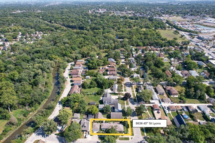 8636 40th Street Lyons, IL 60534 - Photo 47 of 50 an aerial view of residential houses with outdoor space and trees