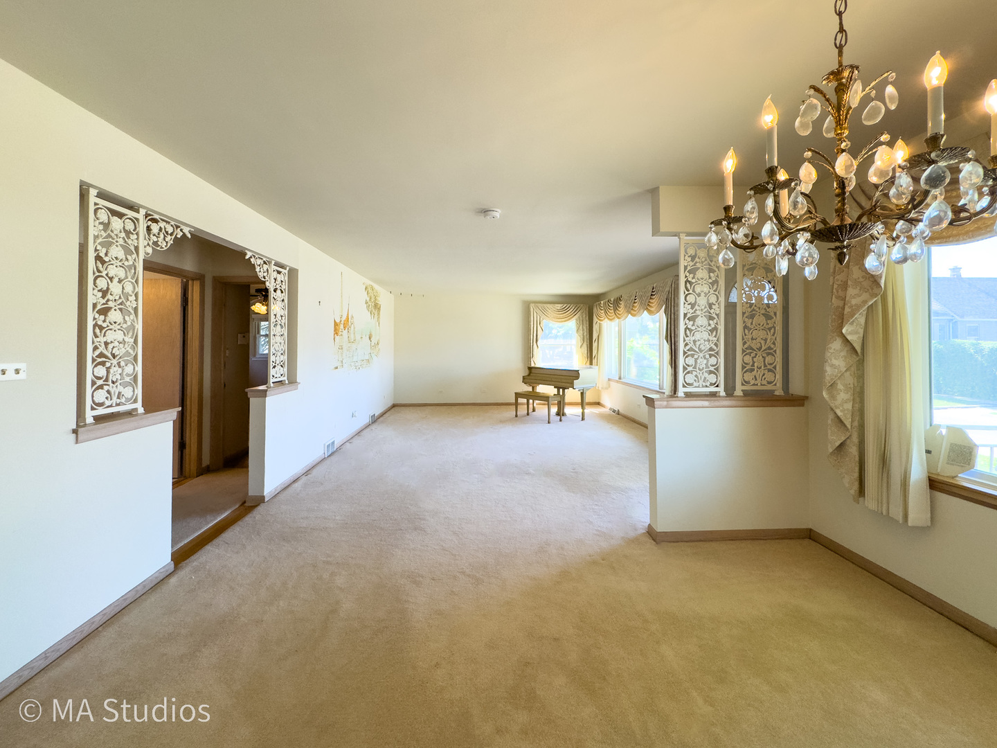 8636 40th Street Lyons, IL 60534 - Photo 6 of 50 a view of a room with chandelier fan and windows