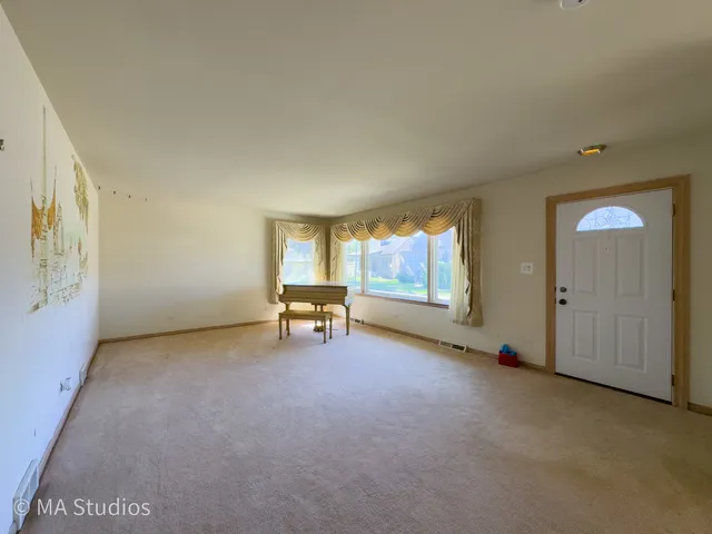 a view of workspace with furniture and window