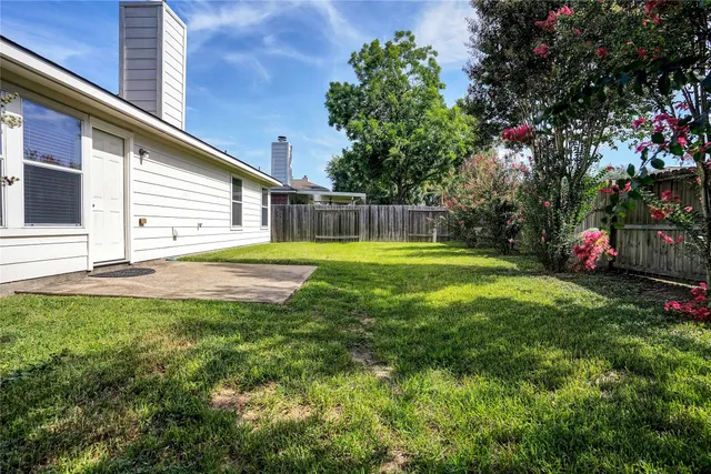 a view of a backyard with a small cabin