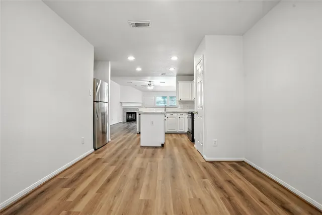 a view of kitchen with wooden floor