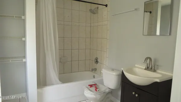 a bathroom with a sink toilet and bathtub