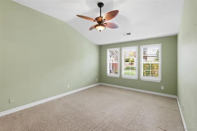 a spacious bathroom with a double vanity sink a mirror and a shower