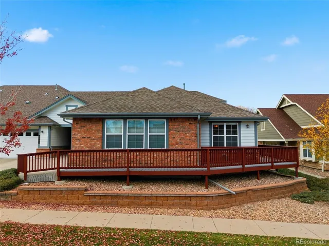 a dining table with chairs a large window and a projector screen