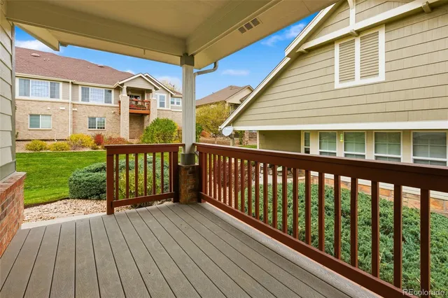 a view of a house with wooden deck