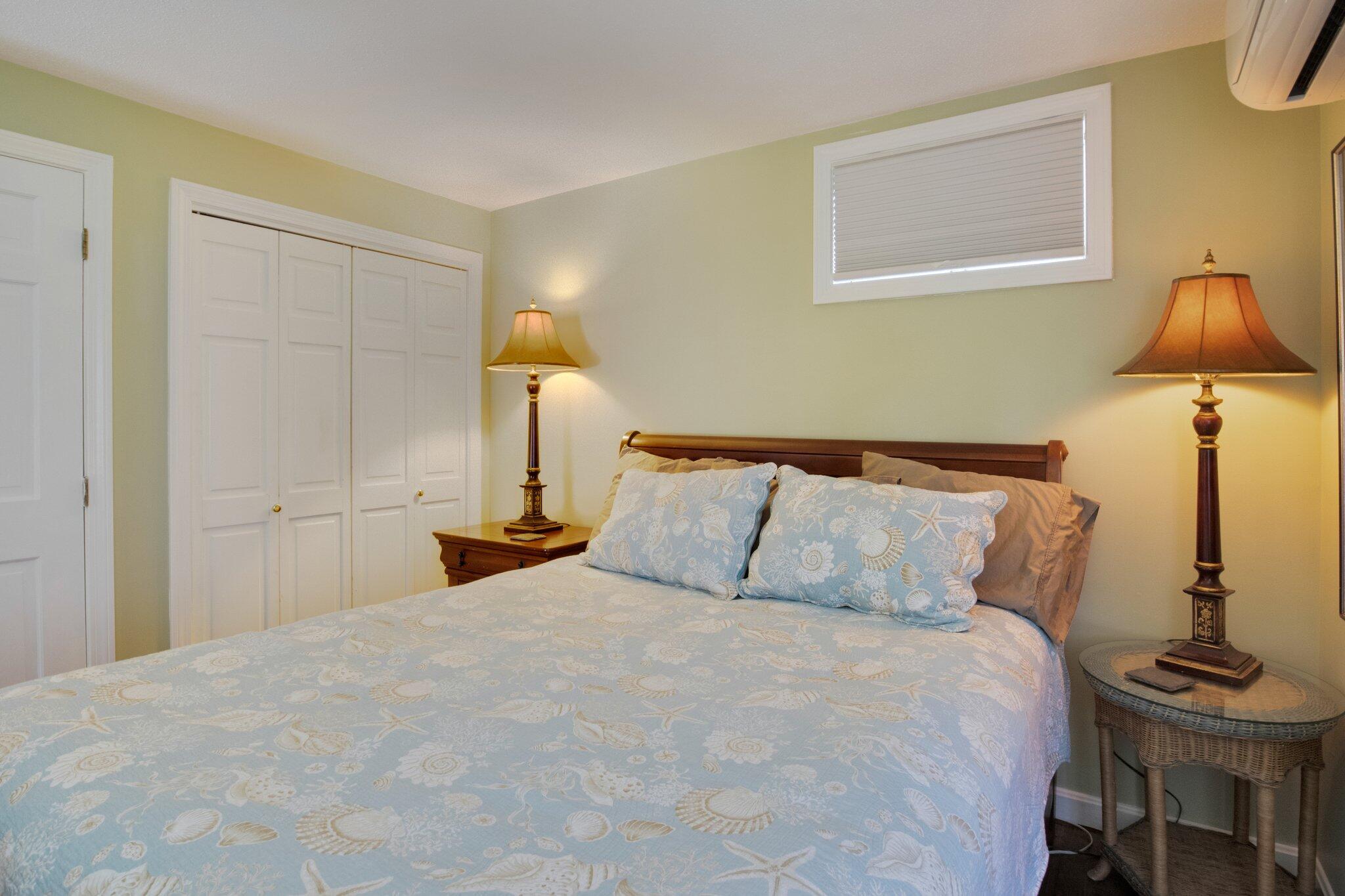 4 Willow Drive, Unit 9 Provincetown, MA 02657 - Photo 17 of 25 a bedroom with a bed and lamp