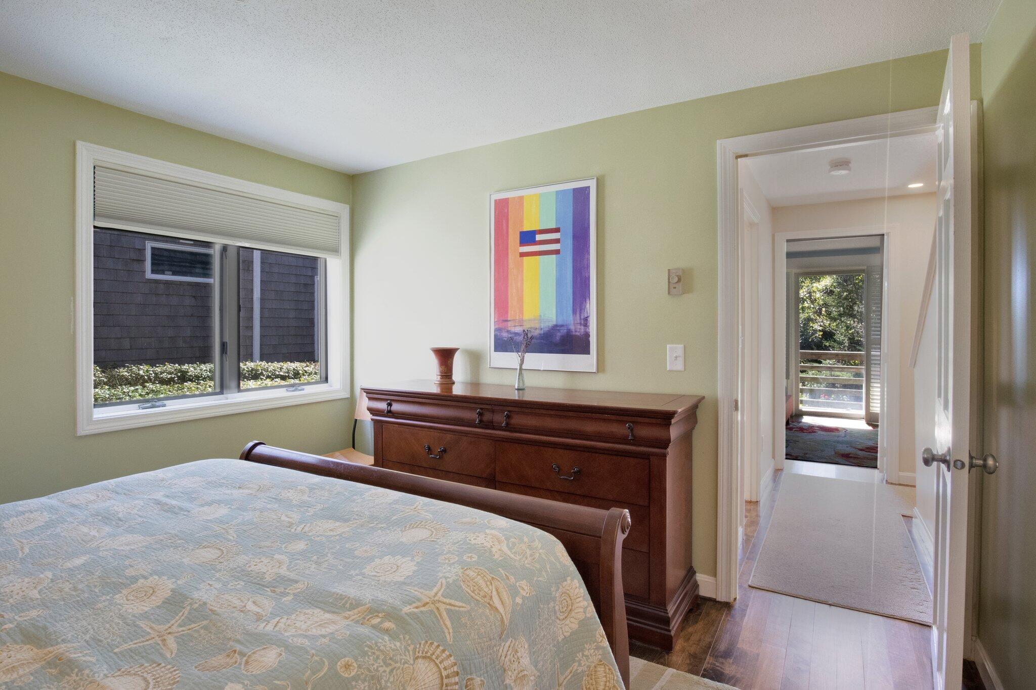 4 Willow Drive, Unit 9 Provincetown, MA 02657 - Photo 18 of 25 a bedroom with a bed and a window