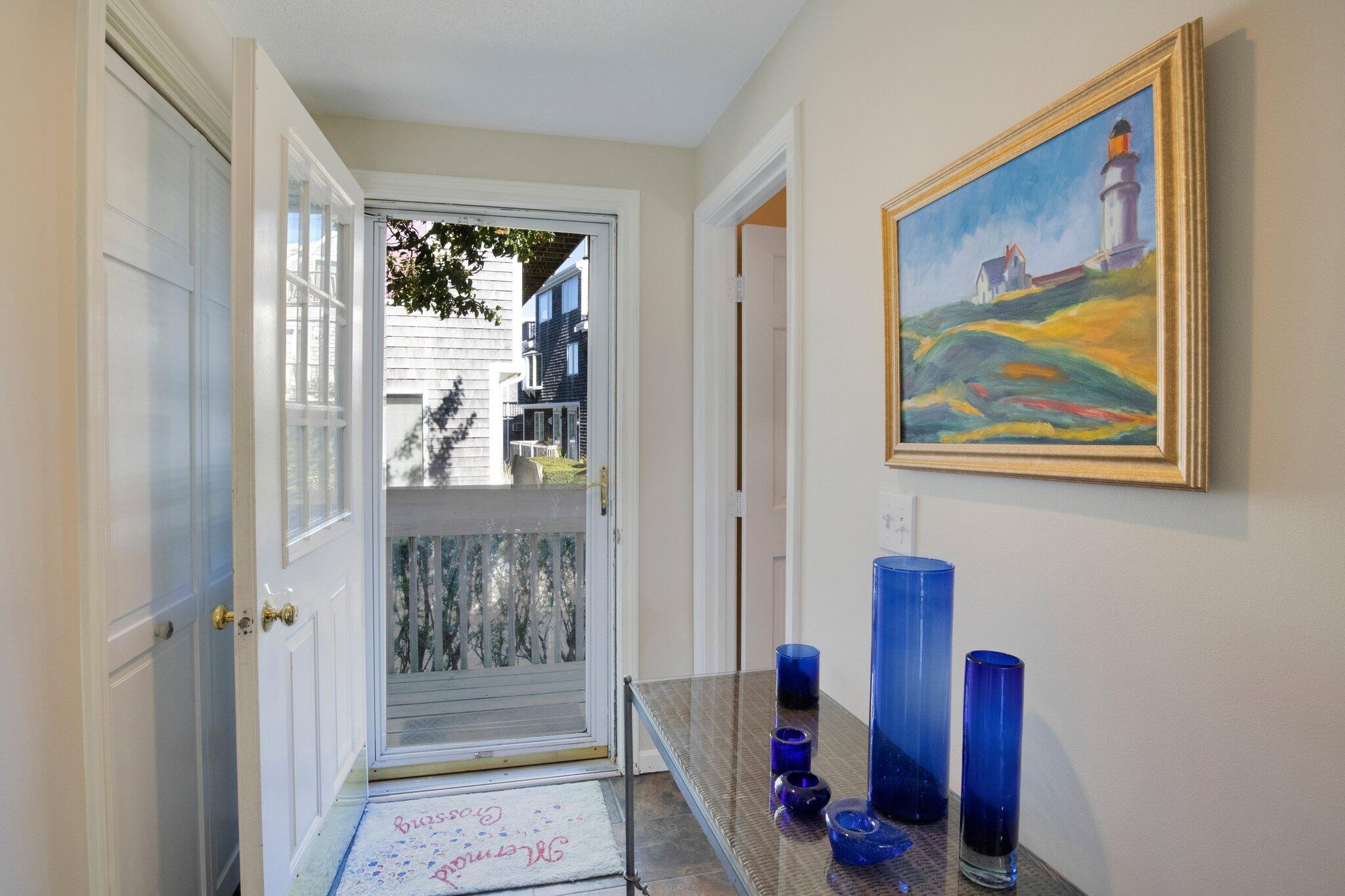 4 Willow Drive, Unit 9 Provincetown, MA 02657 - Photo 6 of 25 a view of a hallway with workspace