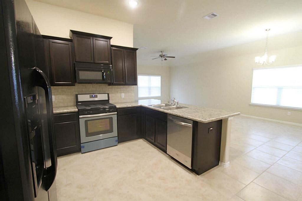 722 Mill Spring Court Rosenberg, TX 77469 - Photo 11 of 11 Kitchen opens to family room.