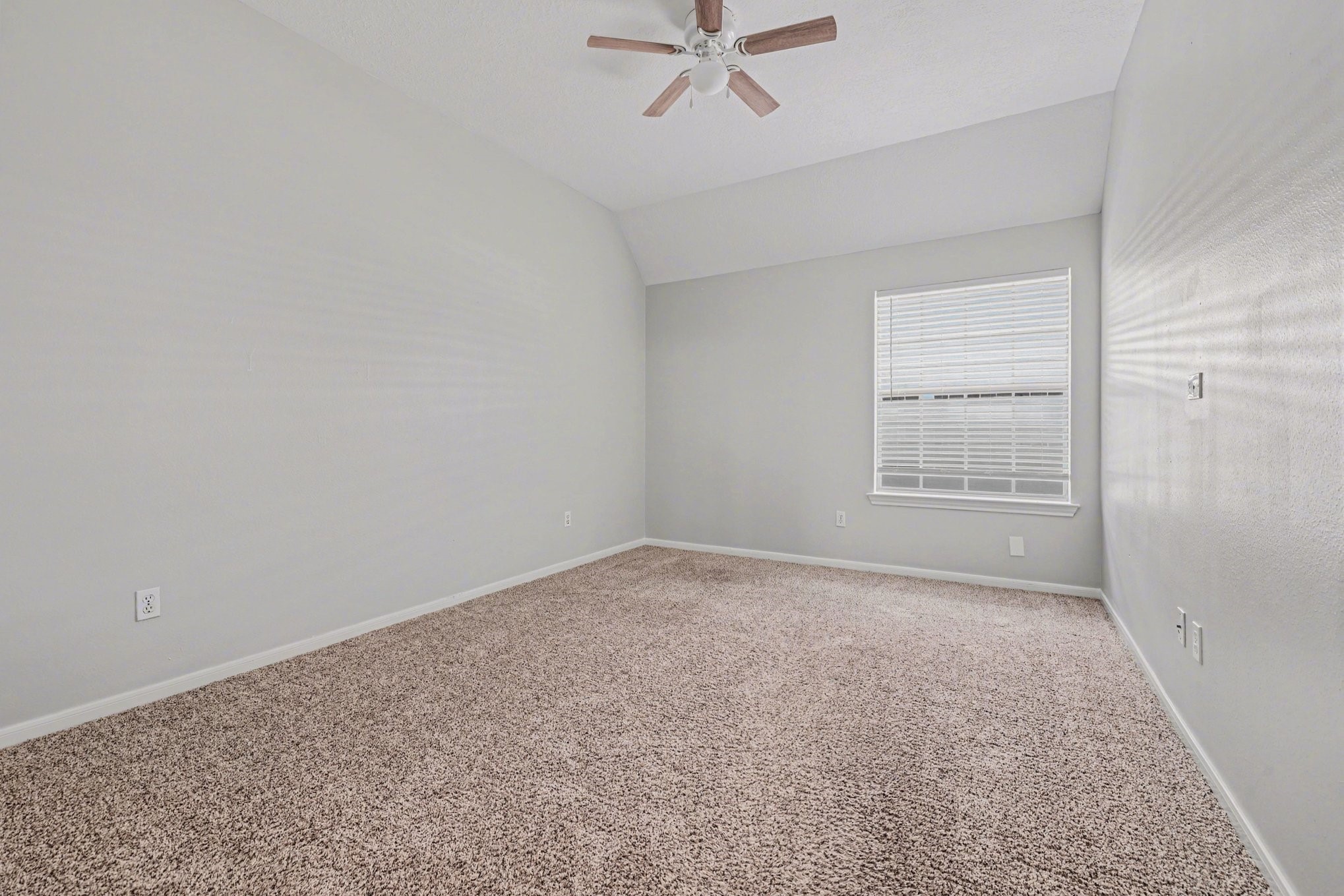 215 Bristol Bend Circle Spring, TX 77382 - Photo 17 of 25 an empty room with windows and fan