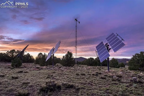 a view of a house with a yard and a large pool