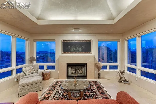 a bedroom with a large bed and potted plant