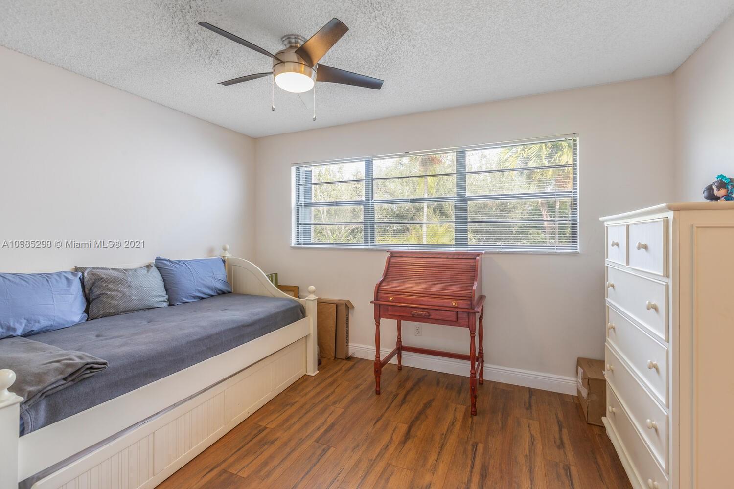 7028 Southwest 53rd Lane Miami, FL 33155 - Photo 14 of 27 a living room with furniture and a window