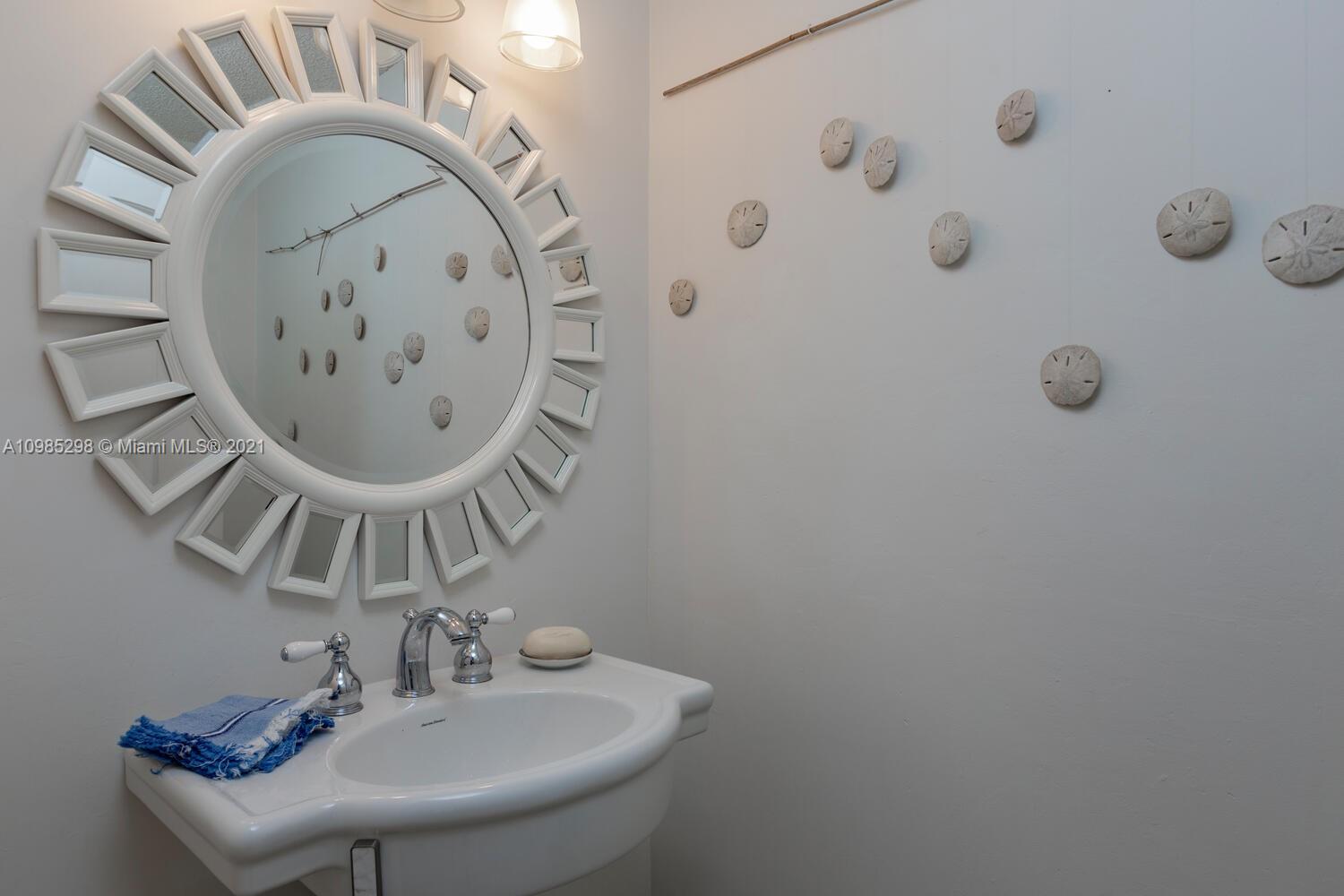 7028 Southwest 53rd Lane Miami, FL 33155 - Photo 16 of 27 a bathroom with a sink and a mirror