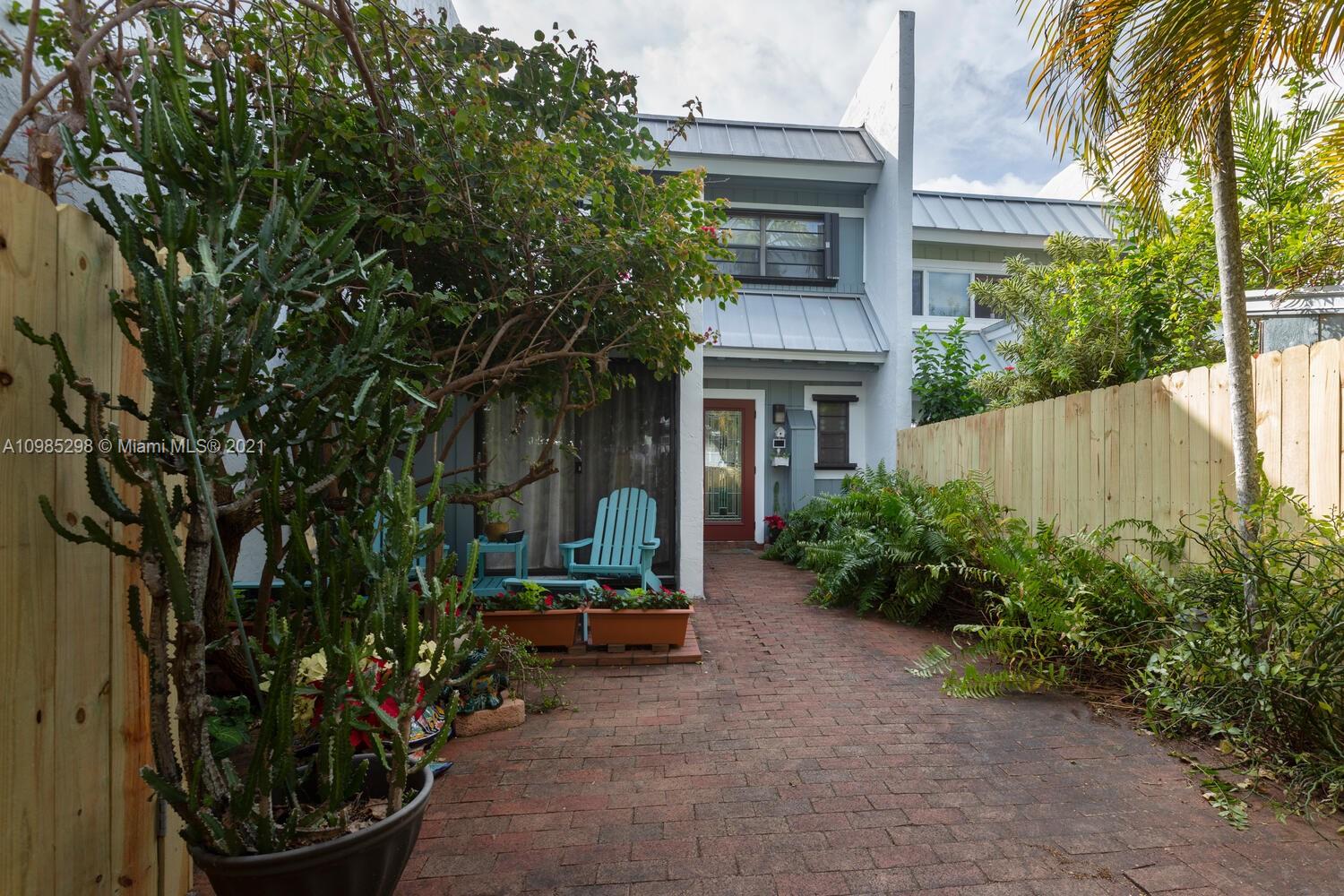 7028 Southwest 53rd Lane Miami, FL 33155 - Photo 2 of 27 front view of a house with a small yard