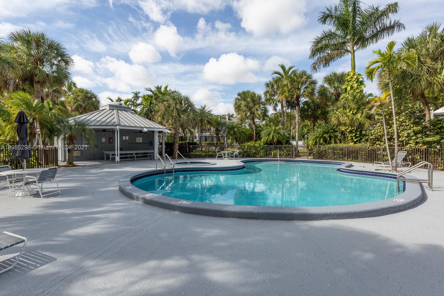 7028 Southwest 53rd Lane Miami, FL 33155 - Photo 25 of 27 a backyard of a house with outdoor seating and barbeque oven