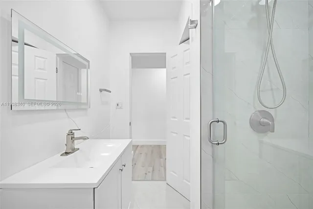 a view of entryway and hall with a sink