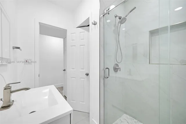 a view of a kitchen with microwave and cabinets