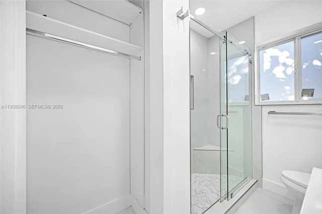 a view of a refrigerator in kitchen and wooden floor