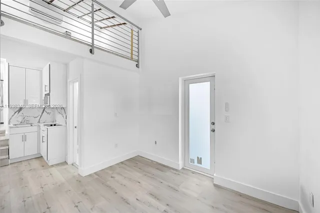 a bathroom with a toilet sink and shower