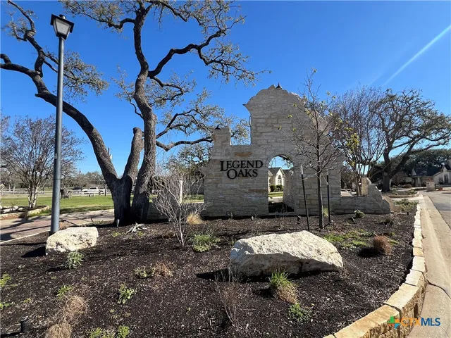 a view of a backyard with sitting area