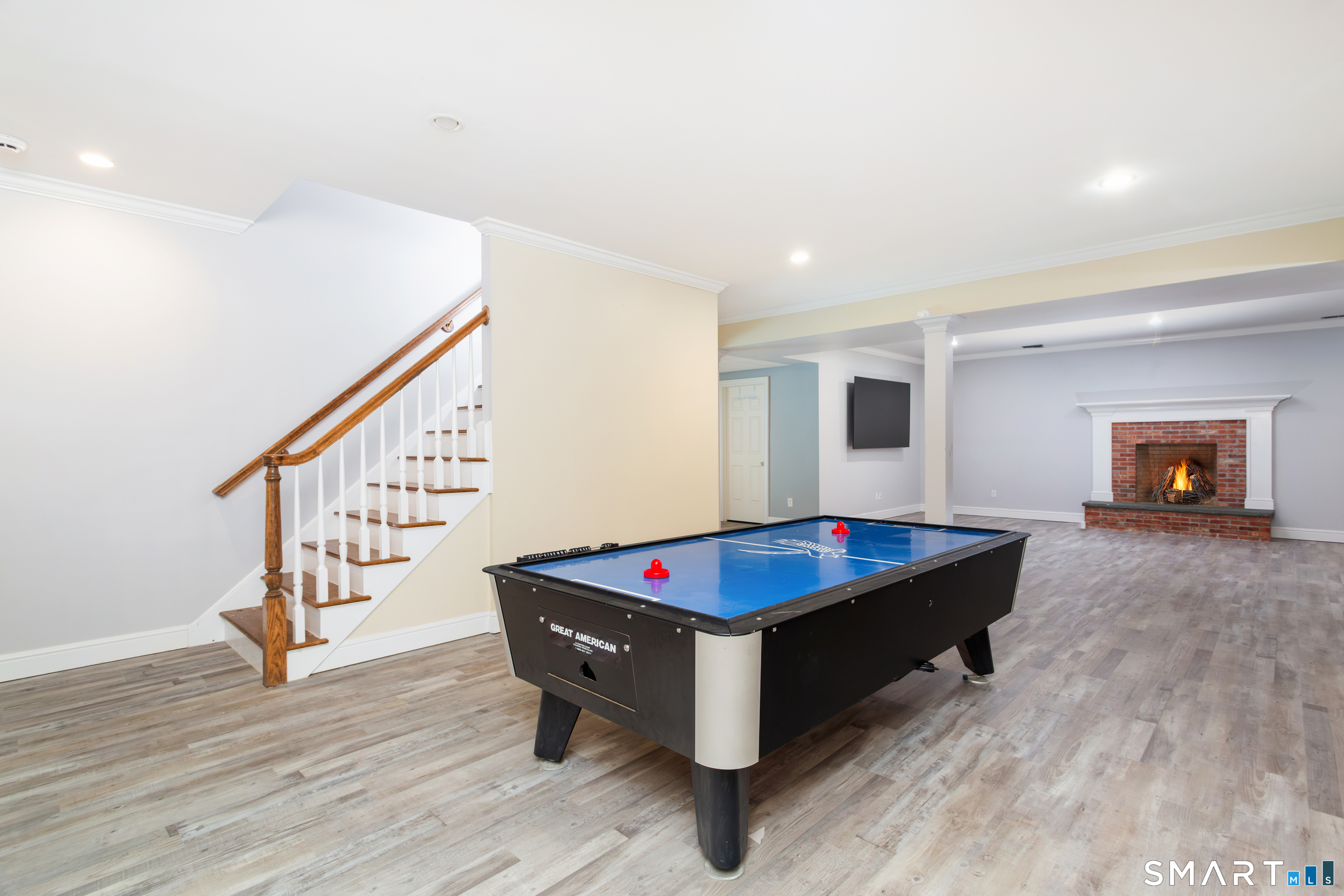 7 Old Hyde Road Weston, CT 06883 - Photo 34 of 40 Fully Finished lower level with front and back stairs