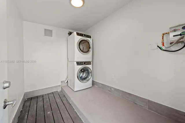 a view of a storage and utility room with washer and dryer