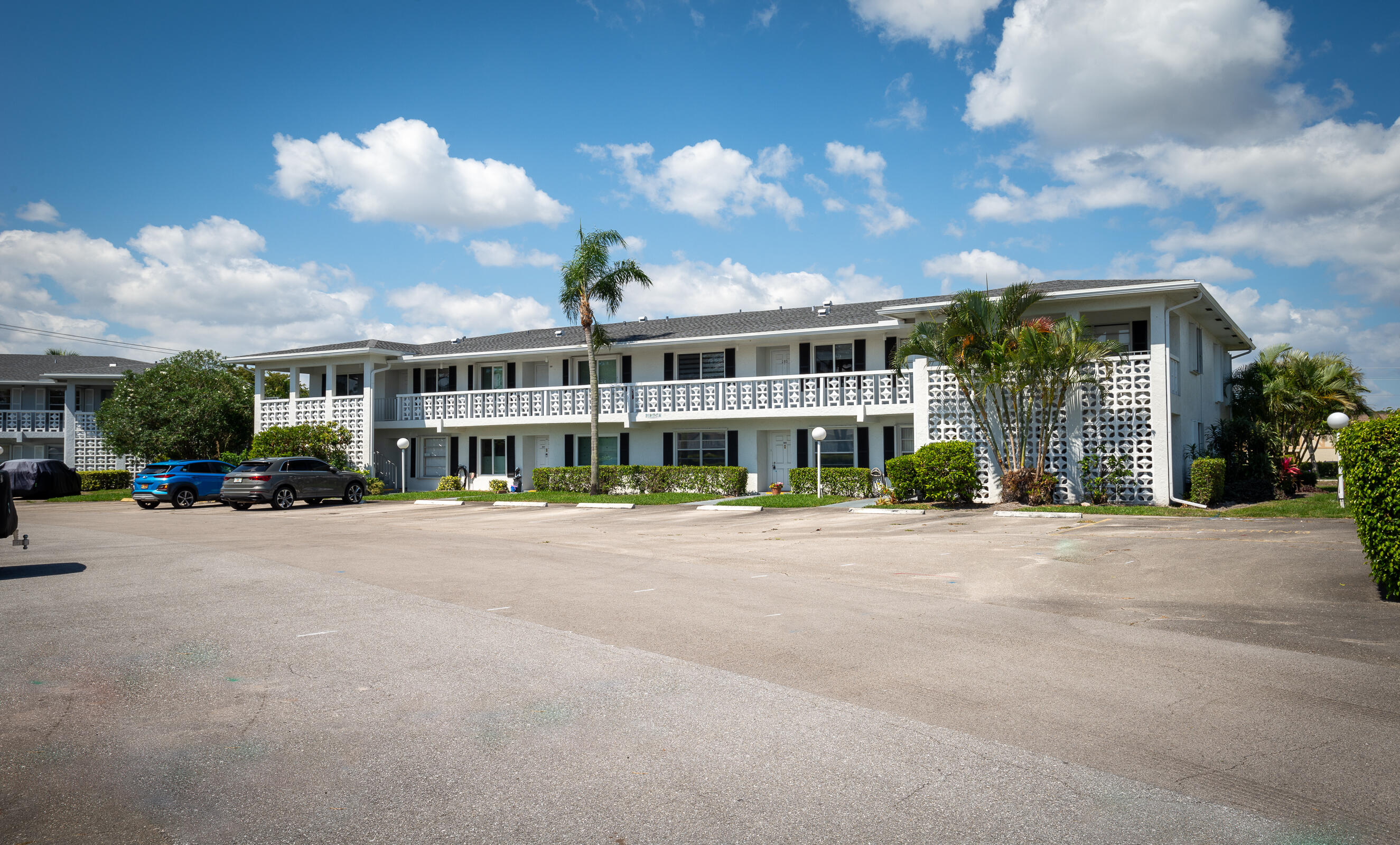 a view of a house next to a big yard