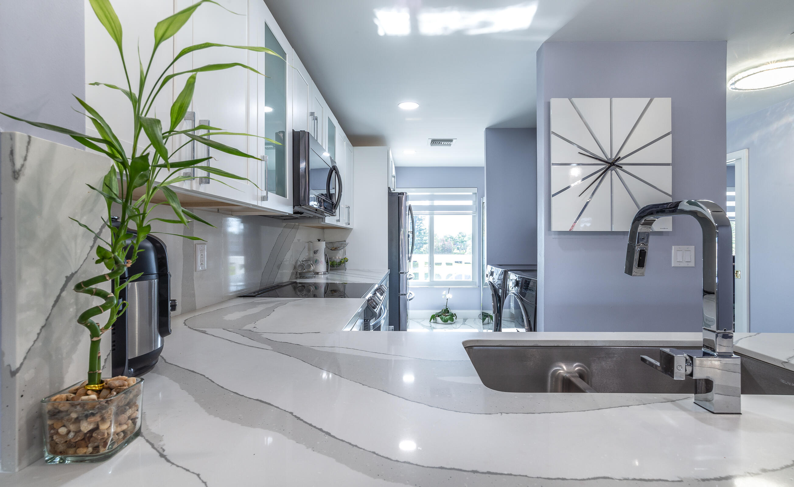 2915 Southwest 15th Street, Unit 203 Delray Beach, FL 33445 - Photo 15 of 48 a living room with furniture and a potted plant