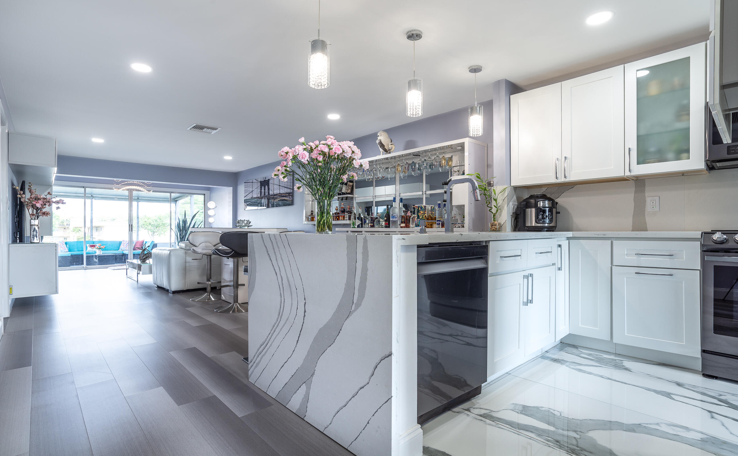 2915 Southwest 15th Street, Unit 203 Delray Beach, FL 33445 - Photo 17 of 48 a kitchen with furniture and a kitchen