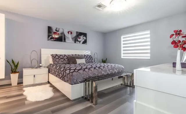 a bedroom with a bed and a table