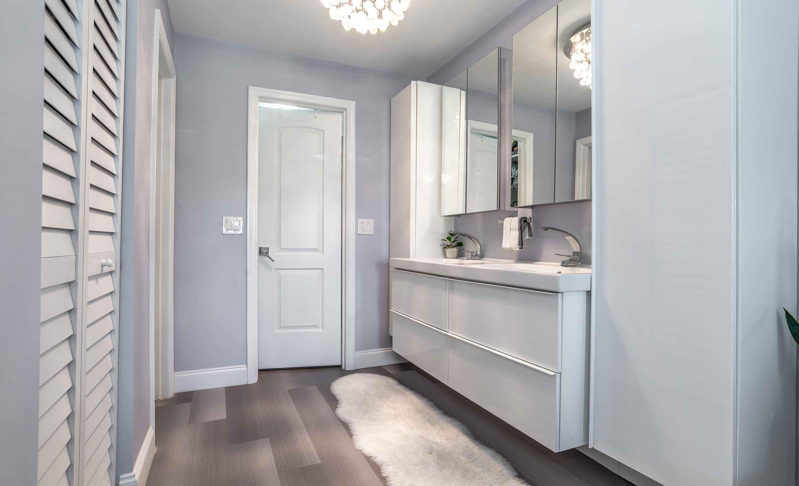 2915 Southwest 15th Street, Unit 203 Delray Beach, FL 33445 - Photo 26 of 48 a bathroom with a sink and a mirror
