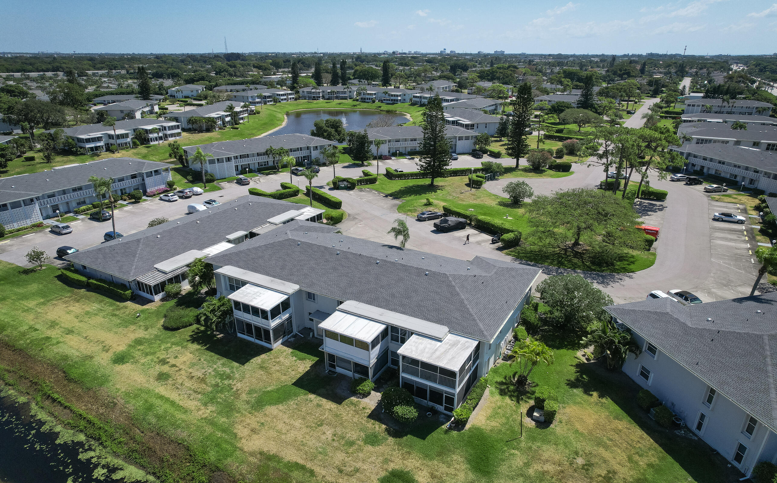 2915 Southwest 15th Street, Unit 203 Delray Beach, FL 33445 - Photo 31 of 48 an aerial view of a house with a yard basket ball court and outdoor seating