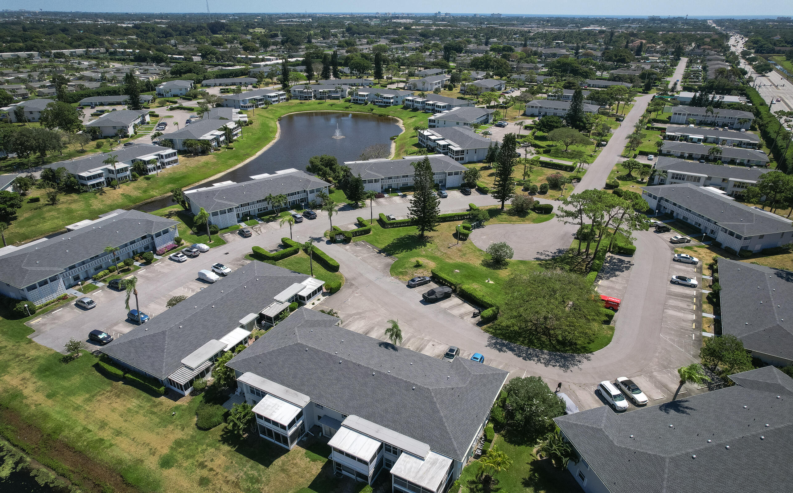 2915 Southwest 15th Street, Unit 203 Delray Beach, FL 33445 - Photo 32 of 48 an aerial view of a city with lots of residential buildings