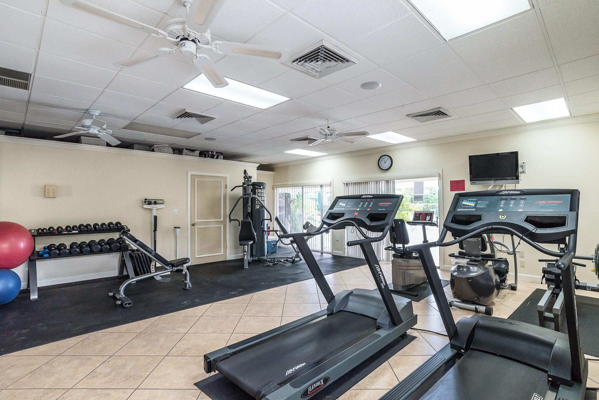 2915 Southwest 15th Street, Unit 203 Delray Beach, FL 33445 - Photo 37 of 48 a view of a room with gym equipment