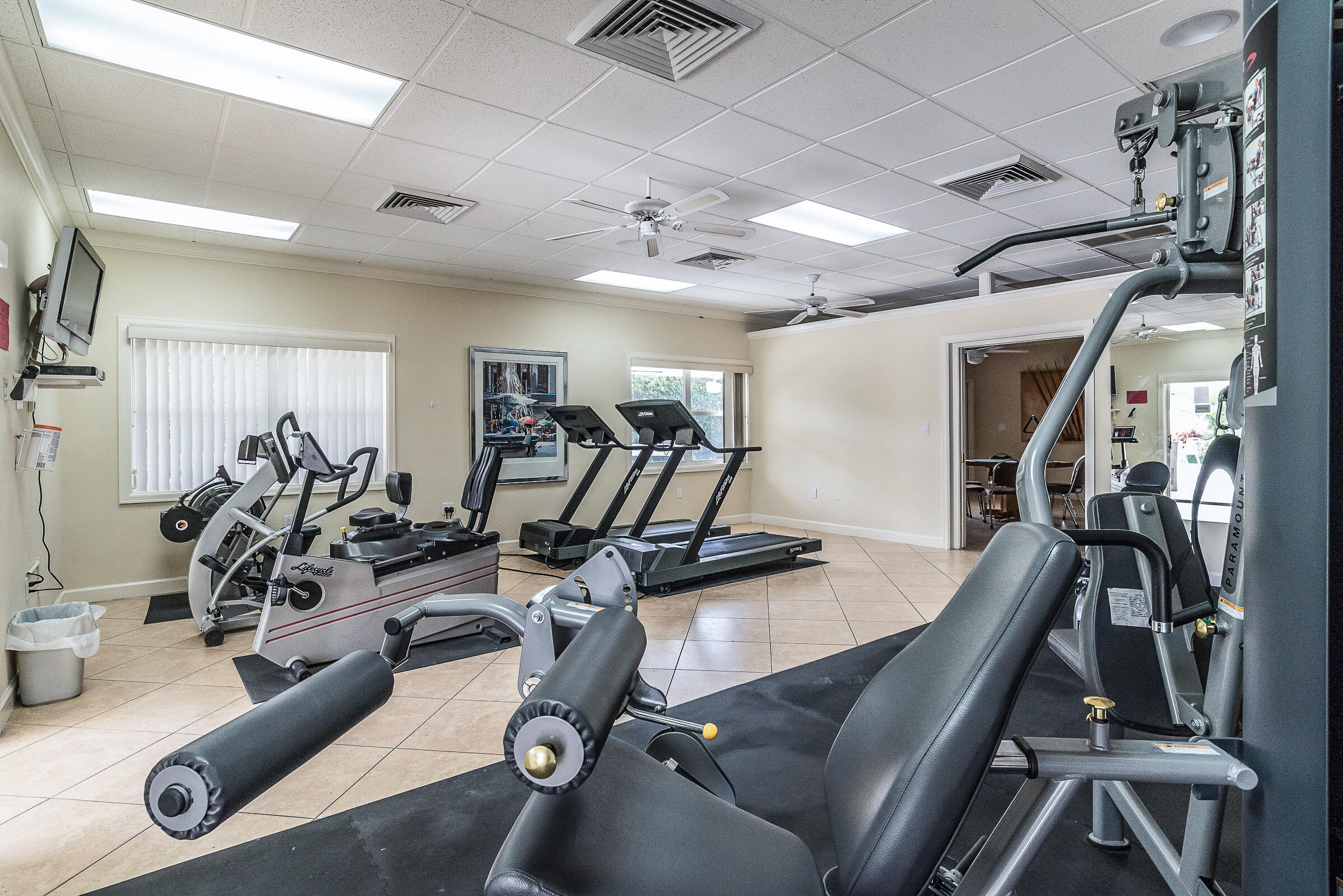 2915 Southwest 15th Street, Unit 203 Delray Beach, FL 33445 - Photo 38 of 48 a view of a room with gym equipment