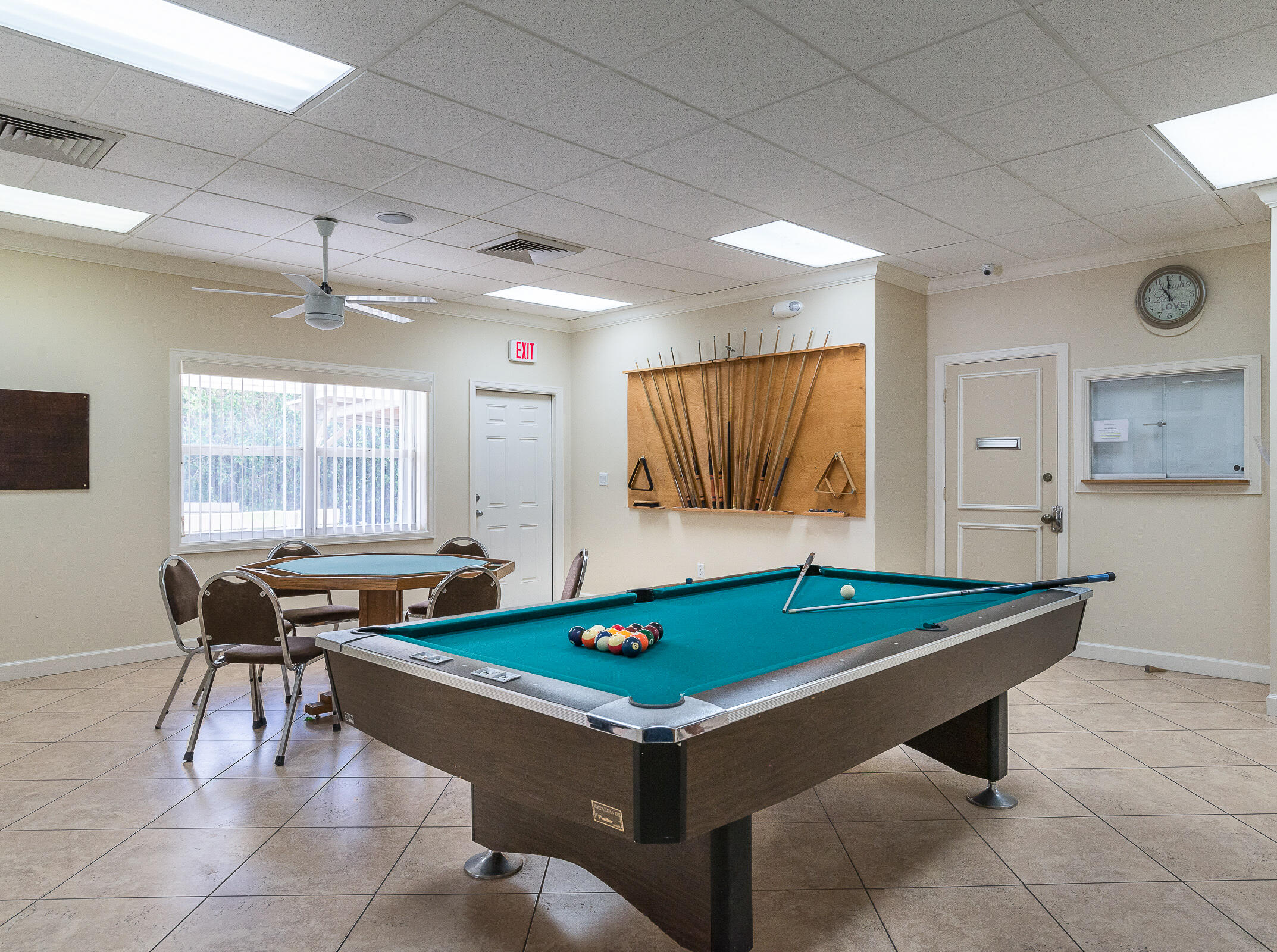 2915 Southwest 15th Street, Unit 203 Delray Beach, FL 33445 - Photo 39 of 48 a room with pool table and windows