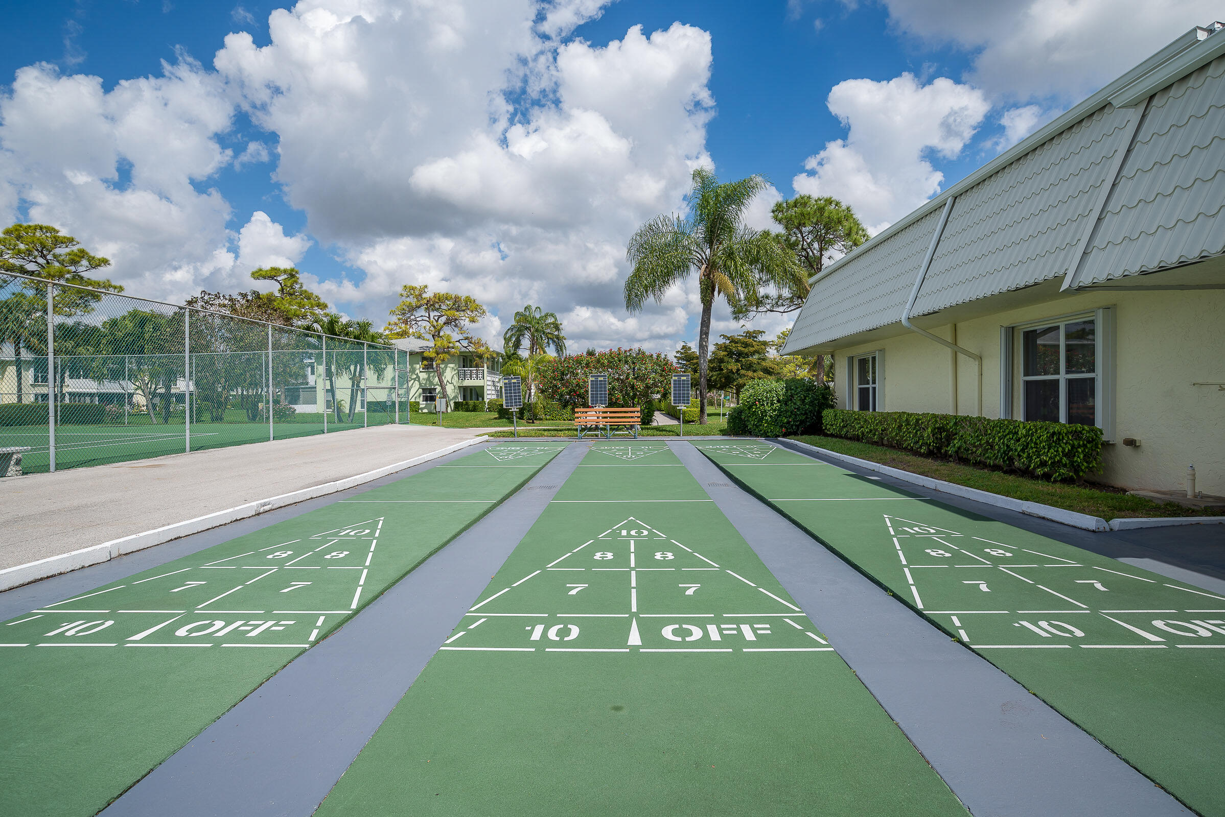 2915 Southwest 15th Street, Unit 203 Delray Beach, FL 33445 - Photo 42 of 48 a view of a pathway of a house with a yard