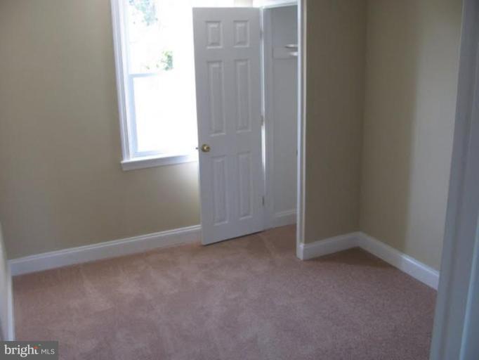 1011 Andover Road Baltimore, MD 21218 - Photo 13 of 29 an empty room with windows