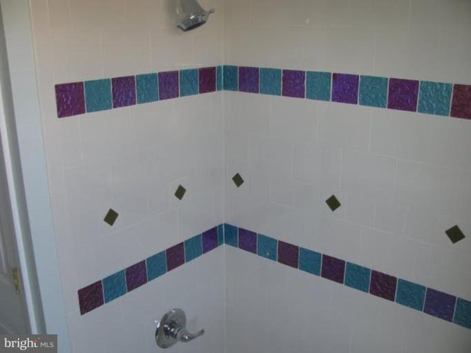 1011 Andover Road Baltimore, MD 21218 - Photo 16 of 29 a bathroom with a and white checkered floor