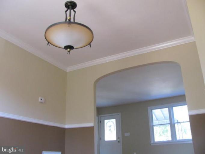 1011 Andover Road Baltimore, MD 21218 - Photo 27 of 29 a view of a chandelier fan and entryway