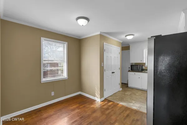 a view of an empty room with a window