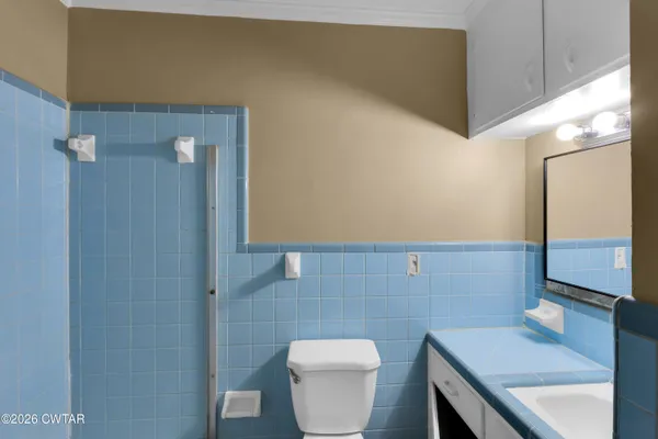 a bathroom with a sink and a toilet